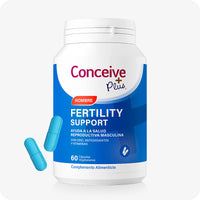 Conceive Plus Men's Fertility Support (ES) supplement bottle designed for male fertility, containing 60 vegetarian capsules. The image displays a blue and white "Hombre" labeled bottle with two turquoise capsules placed beside it on a white background.