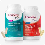 Conceive Plus Motility & Ovulation Support (ES) supplement bundle for male and female reproductive support showing a teal bottle labeled "Ovulation Support Mujer" and a red bottle labeled "Motility Support Hombre," placed side by side with two beige ovulation capsules on the left and two yellowish motility capsules on the right, set against a white background.