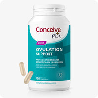 Conceive Plus Ovulation Support (ES) bottle with 120 vegetarian capsules for female ovulation health, shown with a teal label. Image features a white supplement bottle and two beige capsules placed nearby on a light background.
