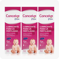 Conceive Plus Fertility Lubricant Pack (ES) triple-pack with three 75ml multi-use boxes, shown with identical magenta packaging in Spanish, baby illustrations, and icons for pH balance and calcium-magnesium content.