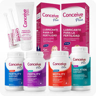 Conceive Plus Maximum Fertility Bundle (ES) with Fertility Lubricant, Women's and Men's Fertility Support, Ovulation Support, and Motility Support supplements in a 6-product bundle for reproductive health — image shows neatly arranged products including lubricant tube with applicators, Spanish-labeled lubricant boxes, and four distinct supplement bottles in vibrant colors, all set against a white background.