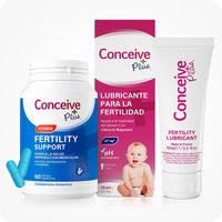 Conceive Plus Men's Fertility Support + Fertility Lubricant (ES) bundle with Fertility Support Hombre and Lubricante para la Fertilidad 75ml. Image shows blue supplement bottle, pink Spanish-language lubricant box with baby icon, and a white tube, arranged on a white backdrop.