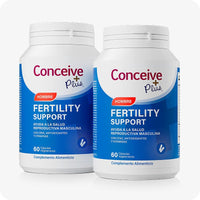 Conceive Plus Men's Fertility Support + Fertility Lubricant (ES) showing 2 pack of Fertility Support Hombre bottles each labeled with red “Hombre” tag and containing 60 vegetarian capsules, placed side by side on a white background.
