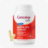 Conceive Plus Men's Motility Support (ES) dietary supplement bottle with 60 vegetarian capsules for male reproductive health shown with a bright red and white label featuring bold text in Spanish and two beige capsules placed at the bottom left on a white background.