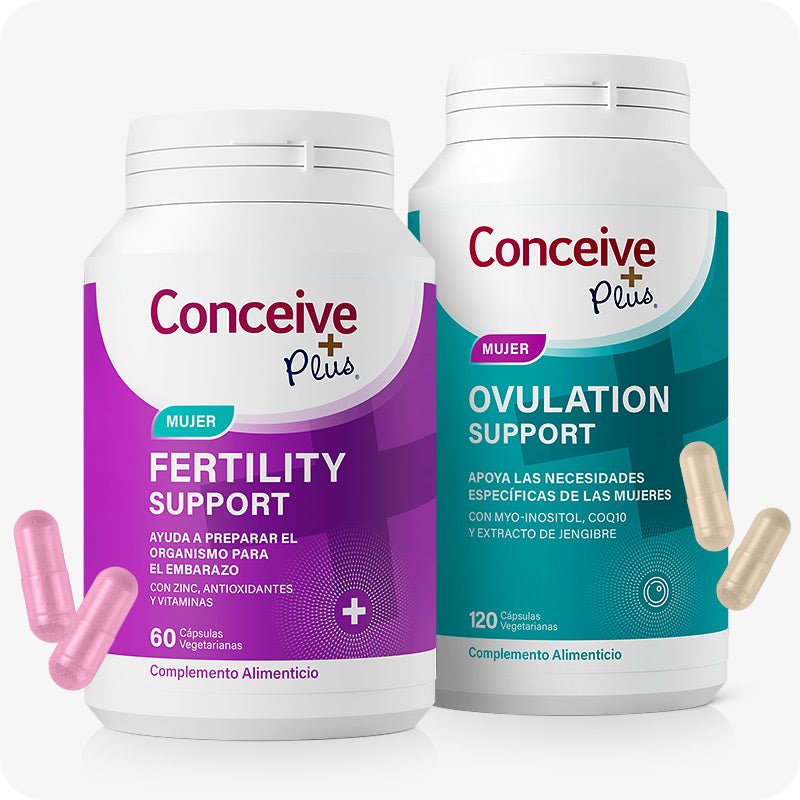 Conceive Plus Ovulation Bundle (ES) with two supplement bottles—Women's Fertility Support in purple and Ovulation Support in teal—displayed front-facing with pink and beige capsules placed beside them for clear identification.